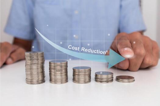 Stack of coins in descending order with down arrow. Cost reduction concept. photo