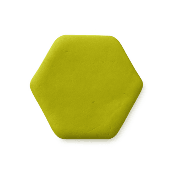 un' singolo chartreuse verde esagonale oggetto con un' Opaco granuloso struttura e morbido arrotondato bordi. png