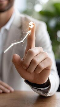 Businessman pointing finger with dollar sign on it photo