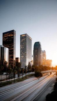 A city skyline with a highway and tall buildings photo
