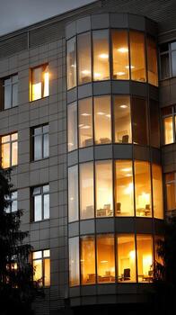 A building with many windows and a large glass door photo