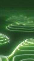 Abstract green glowing contour lines forming wave-like patterns on a dark surface video