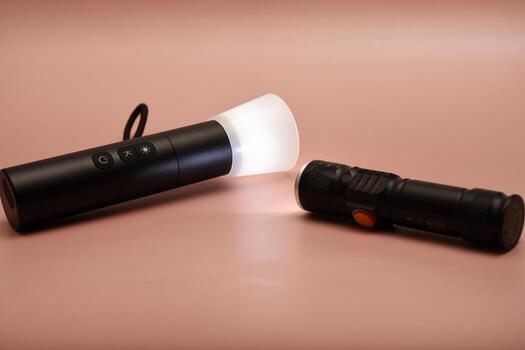 Flashlight with zoom lens function. Technical and functional. Displayed on an industrial metal surface. photo