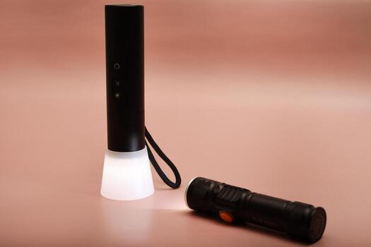 Compact emergency flashlight. Ideal for travel kits and home safety. A simple setup on a white background. photo