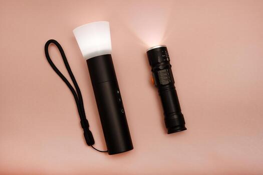 Pocket-sized flashlight for everyday carry. Minimalist torch with metallic body. Photographed on a neutral surface. photo