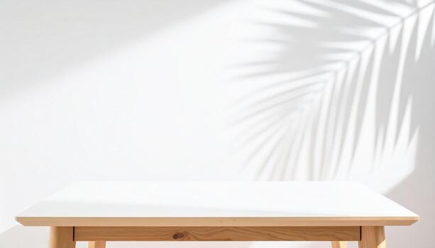 Serene summer backdrop features delicate palm leaf shadow cast upon pristine white table, creating calming and inviting atmosphere photo