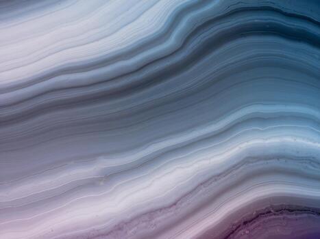 Abstract wavy pattern in soft hues of blue, gray, and purple creating a calming visual effect. photo