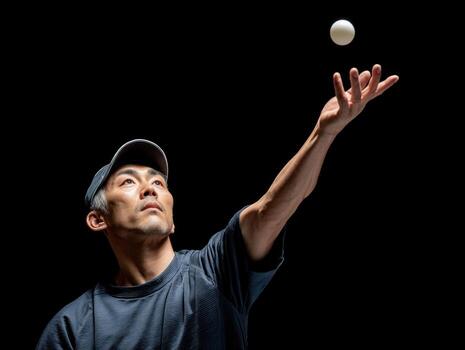 Table tennis player serving with high spin ball, focused expression, dark background, athletic male, dynamic action photo