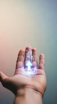 Hand holding a glowing arrow pointing to a digital icon photo