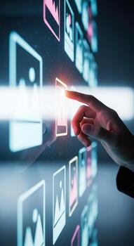 Persons finger touching a glowing digital interface with images photo