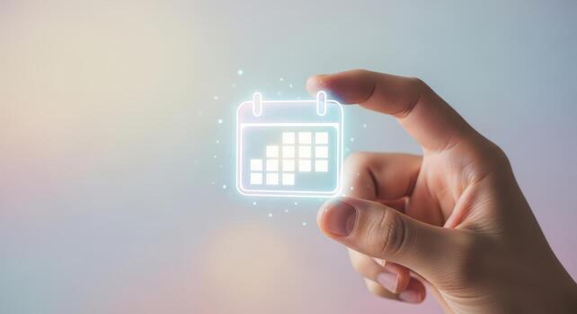 Hand touching a glowing calendar icon, time management concept photo