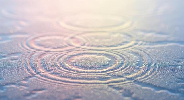 Raindrops creating concentric circles on a calm water surface photo