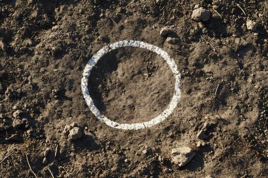 A white circle is drawn on the ground photo