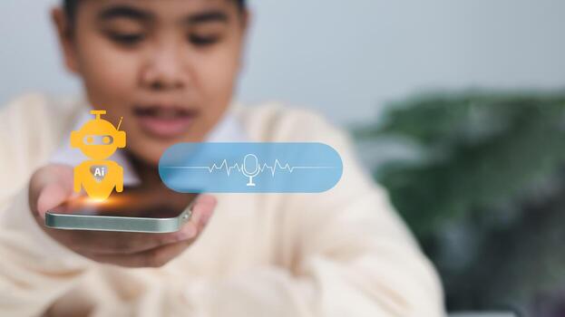 Speech recognition, voice command, and artificial intelligence technology. Young boy speaking to smartphone with AI voice assistant icon. voice chat ai. photo