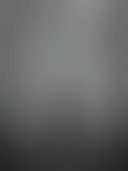 A soft, blurred image featuring shades of gray, creating a minimalist and abstract atmosphere.Classic black gradient background vector