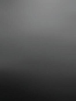 A smooth gradient of gray shades creates a minimalist, monochromatic background, evoking a sense of calmness and simplicity. vector