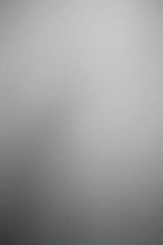 A soft, blurred image featuring shades of gray, creating a minimalist and abstract atmosphere. vector