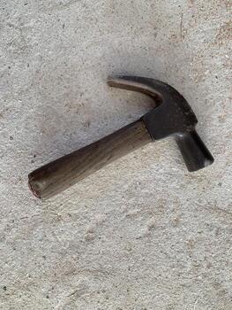 a hammer tool on floor background photo
