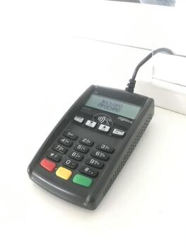 Payment terminal on a counter in a retail store photo