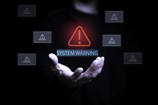 System warning alert with hacker breach notifications floating above businessman hand, representing cybersecurity threat, data breach, and network vulnerability in technology and IT security concept. photo