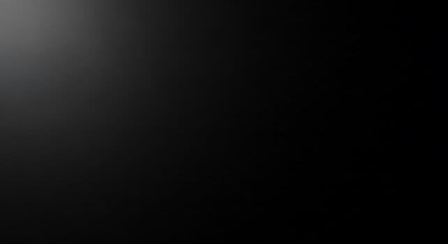 Dark black gradient background with subtle lighting effect for design projects photo