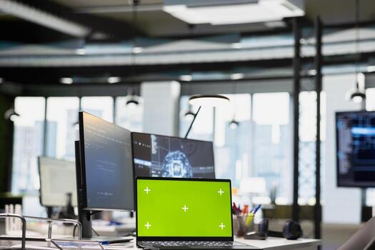 Green screen laptop on AI startup office desk displaying artificial intelligence programming languages code. Chroma key notebook used for AI machine learning testing and quality assurance photo