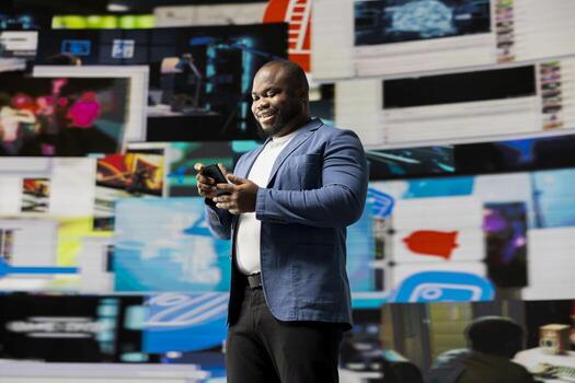Smiling user navigating through online content and mobile apps, surrounded by visual elements of social engagement, tech communication and modern digital platforms on his smartphone. photo
