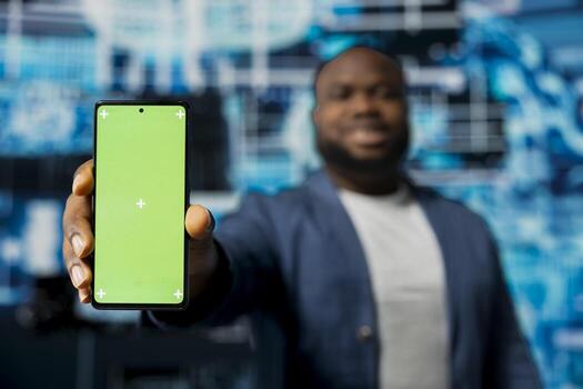 African american adult showing device with copy space screen with predictive analytics immersed in AI brain development and machine learning. Smart technology and high tech cybernetics. photo