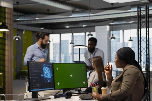 Programmer in tech startup uses AI on chroma key PC to optimize performance and forecast issues. Woman writing code in office, training machine learning models using isolated screen computer photo