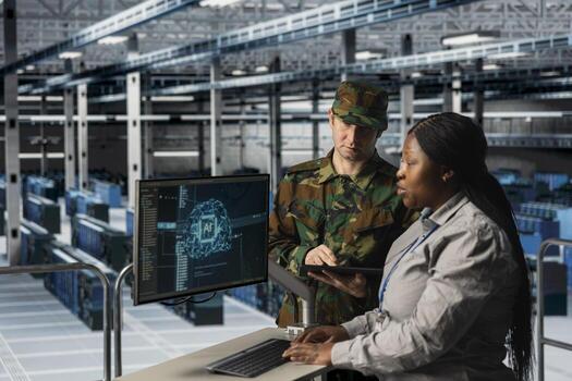 Military server room engineers integrating artificial intelligence into defense infrastructure planning. Data center army specialists analyzing battlefield simulations using predictive AI models photo