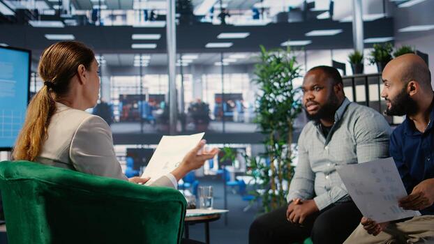 Office meeting highlighting leadership and business planning for a new partnership between powerful people using metrics and strategy to drive performance and development. Camera A. photo