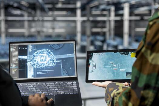 Close up of military operator and IT expert in army data center using AI on laptop to manage autonomous defense systems. Soldier and programmer using AI for strategic threat detection photo