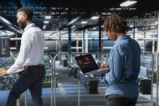 Woman expert in data center stressed by critical error popup on laptop during diagnostics session on industrial platform. Anxious staff troubleshooting system fault affecting performance. photo