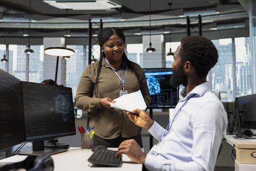 Bookkeeper in office reviewing financial records using AI assistant for support. Accountant using large language model chatbot to automate routine calculations and reporting tasks photo
