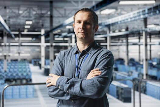 Portrait of data center engineer analyzing infrastructure performance, resolving hardware failures. Server farm IT professional doing job tasks, optimizing network equipment photo