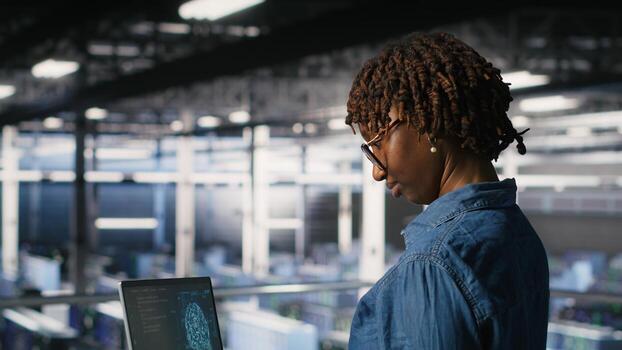 Data center coworkers doing maintenance on mainframes handling AI processing tasks. Server hub system administrators managing storage arrays supporting deep learning training workflows photo