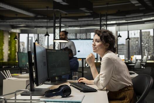 Motivated employee analyzing performance metrics and reports, applying business strategy and insights to enhance management practices and ensure corporate success. Modern workspace. photo