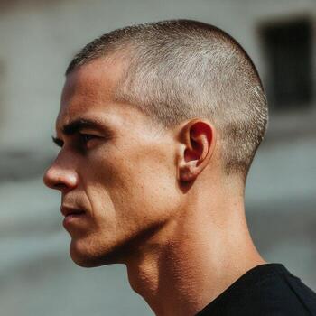 Man with short hair profile view photo