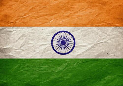 The indian national flag, a tricolor with the ashoka chakra, displayed on a textured background photo