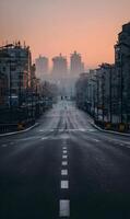 urbano Mañana paisaje urbano presentando vacío asfalto la carretera con blanco líneas líder hacia distante edificios envuelto en suave pastel amanecer matices creando un escénico tranquilo y foto