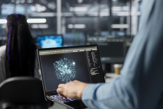 Close up of admin using laptop in data center, optimizing hardware for AI tasks. Server room IT worker using notebook, automating system diagnostics using deep learning predictions photo