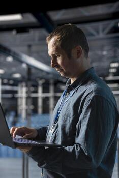 Data center engineer analyzing system performance, reducing downtime and preventing equipment failures. Server farm employee automating anomaly detection during routine operations photo