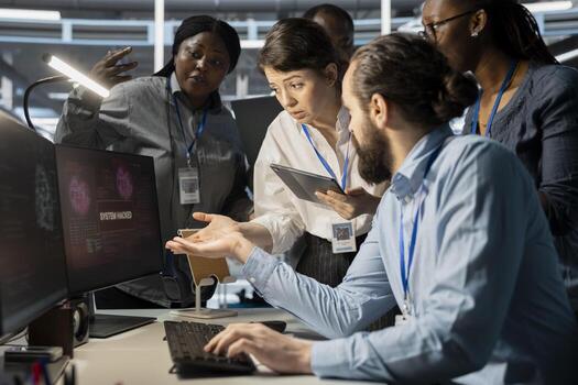 Data center technicians reacting to virus alert on computer monitor, initiating protocol to protect critical systems. Server room teamworking colleagues assessing compromised gear after hacker attack photo