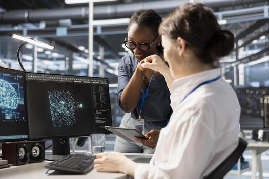 Cheerful data center admins doing fist bump, celebrating successful AI implementation. Jolly server hub teamworking coworkers excited after optimal results achieved by artificial intelligence model photo
