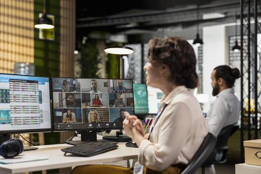 Employees sharing ideas on a web conference call at the workstation, discussing about project briefing with charts and reports. Business associates attending online meeting event. photo