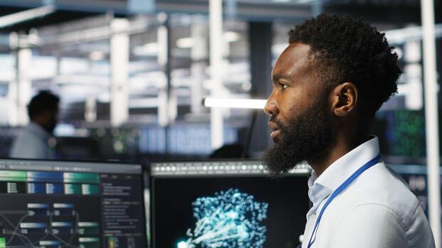 Server hub admin using AI neural network node tree program to optimize system health. Data center IT professional analyzing equipment issues using deep learning AI visualization, camera B photo