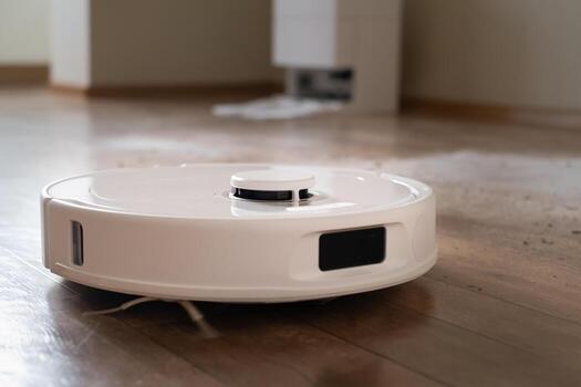 Time management with smart technology robot cleans the floor efficiently saving time for the owner. photo
