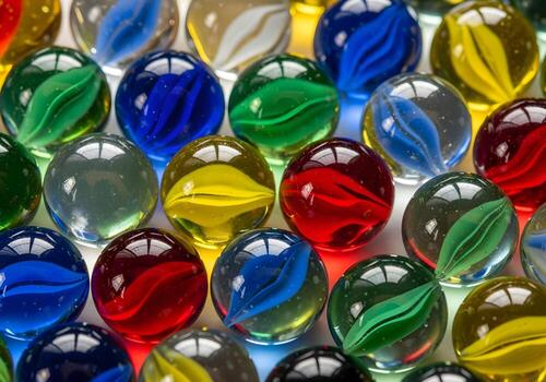 Macro shot of glass marbles with reflection and light bending effects, arranged in abstract pattern with clean high-resolution capture and no human or branding elements photo
