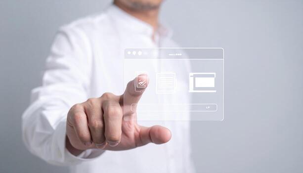 A man is pressing a button on a touch screen photo