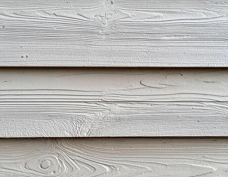 Weathered wall of aged wood features subtle linear relief, showcasing its natural texture and character photo